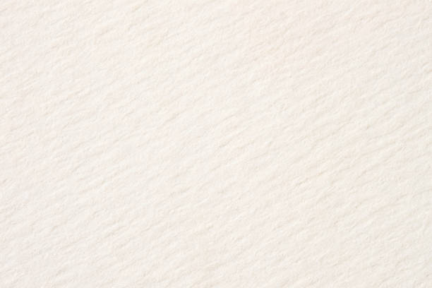 Texture of cream-coloured pastel paper for artwork close-up, light tones. For backdrop, substrate, composition use. With place for your text