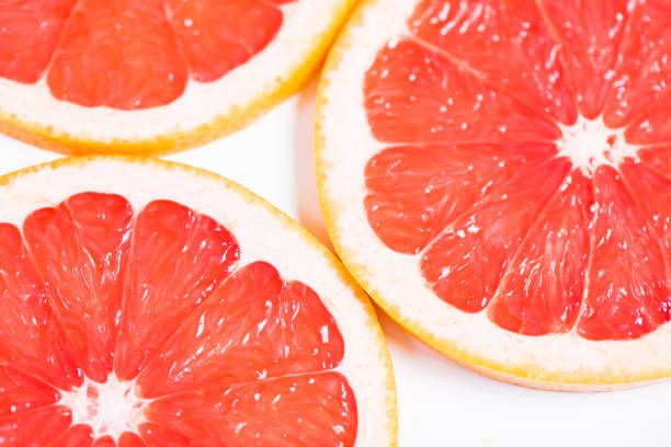 istock Texture of a ripe grapefruit slice, closeup 660914954
