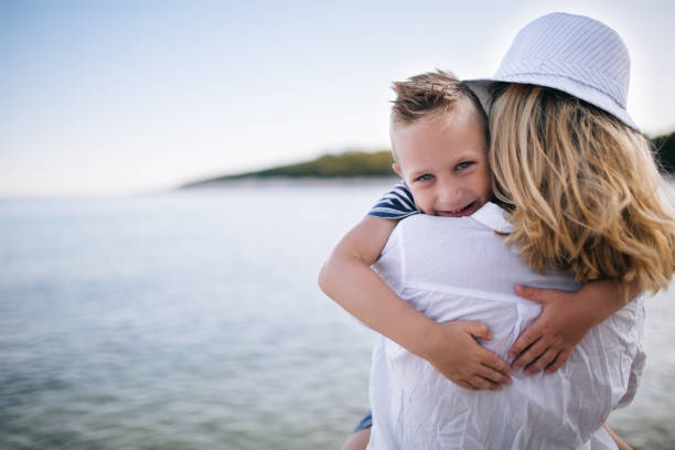 istock Mother and son by the sea 660920618