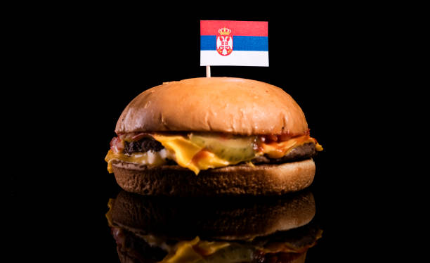 istock Serbian flag on top of hamburger isolated on black background 660923132
