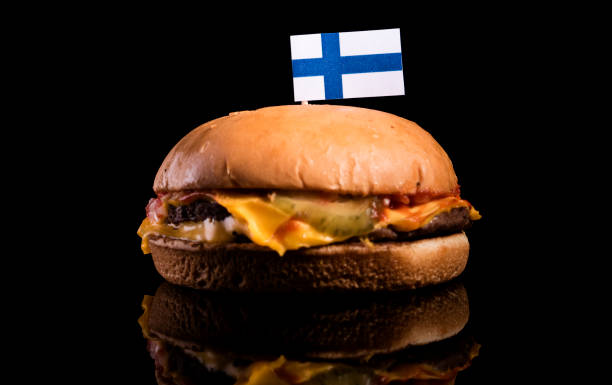 istock Finnish flag on top of hamburger isolated on black background 660938668