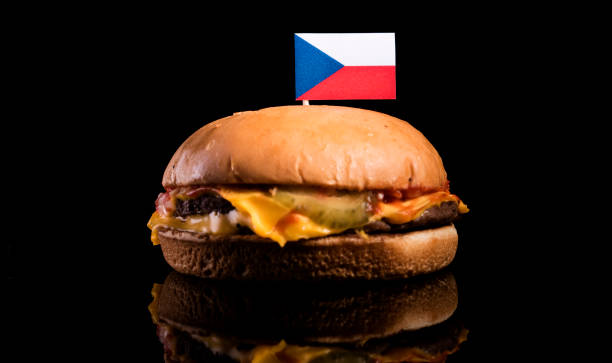 istock Czech flag on top of hamburger isolated on black background 660938870