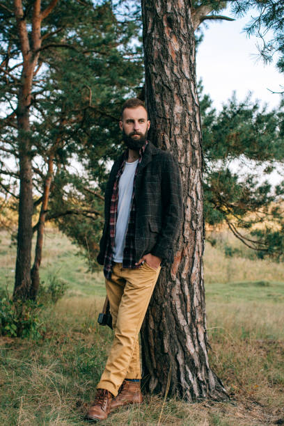 istock bearded and moustached  man in the forest. Travel style 660945974