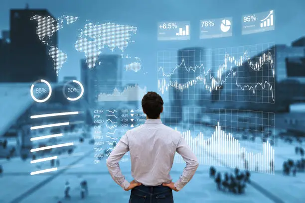 Person analyzing a financial dashboard with key performance indicators (KPI) and business intelligence (BI) charts with a business district cityscape in background