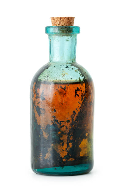 istock Bottle of herbal infusion or essential oil on white. 660955448