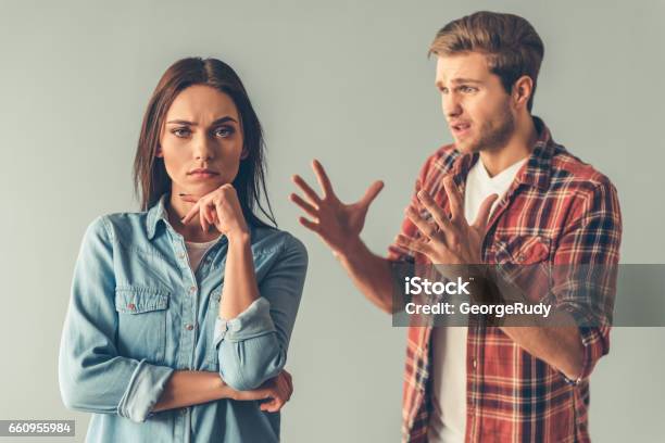 Young Couple Having A Quarrel Stock Photo - Download Image Now - Arguing, Couple - Relationship, Women