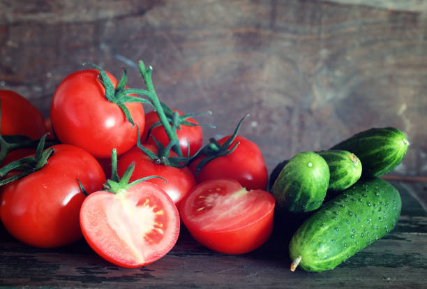 istock tomatoes on wooden background 660962216