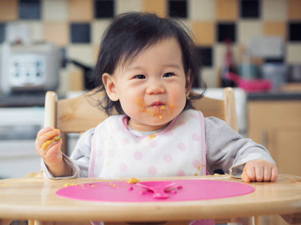 istock eating mess baby girl 660985548
