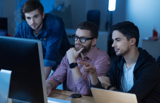 istock Intelligent handsome man pointing at the screen 660999750