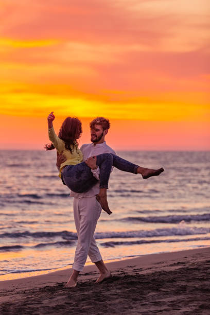istock Young couple having fun on a sandy coast 661000688