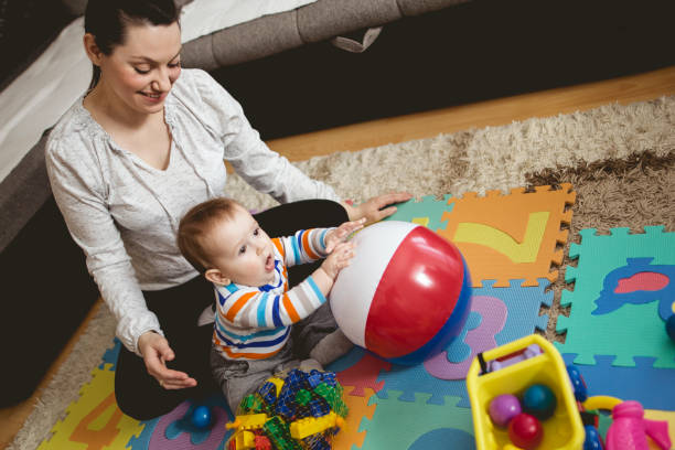 istock Mother reading book with child 661021482