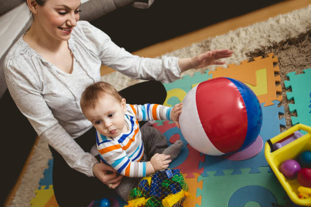 istock Mother reading book with child 661021726