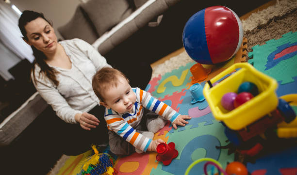 istock Mother reading book with child 661021866