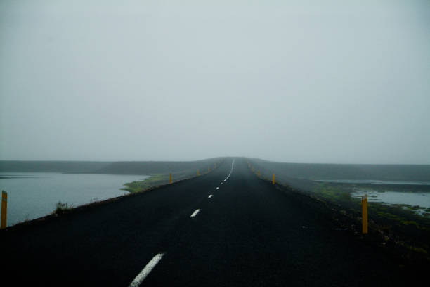 istock Foggy road on the middle of nothing 661022654