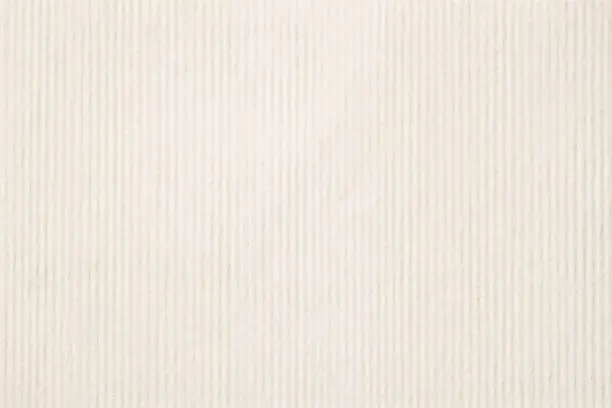 Photo of Texture of light cream in a strip paper, gentle shade for watercolor and artwork. Modern background, backdrop, substrate, composition use with copy space