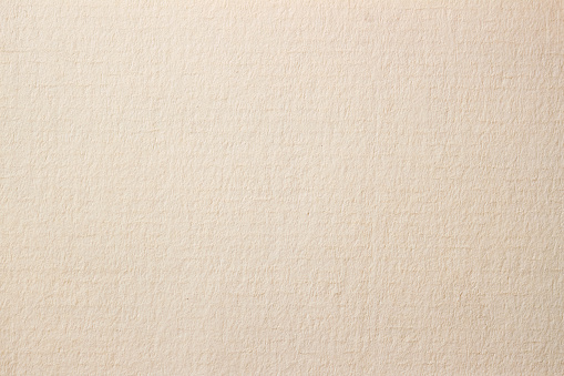 Texture of light cream paper for artwork. Modern background, backdrop, substrate, composition use with copy space