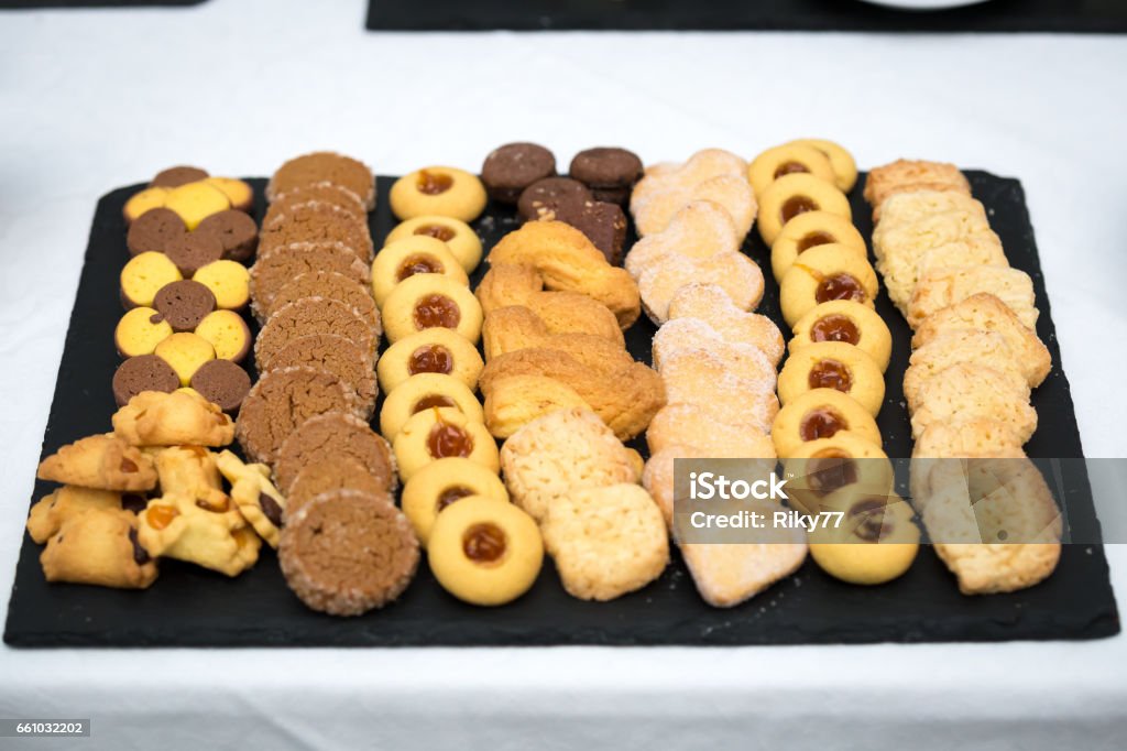 A dish full of cookies A dish with a lot of cookies and choccolate Appetizer Stock Photo