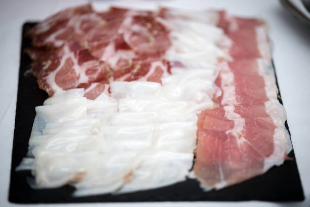 A dish full of italian sliced ham stock photo