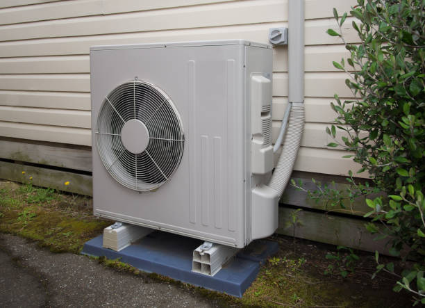 Air conditioning and heating unit for a residential house stock photo