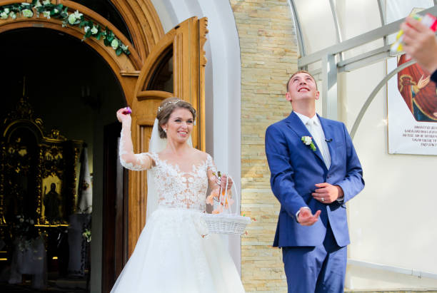istock Just married throwing candy at church 661066834