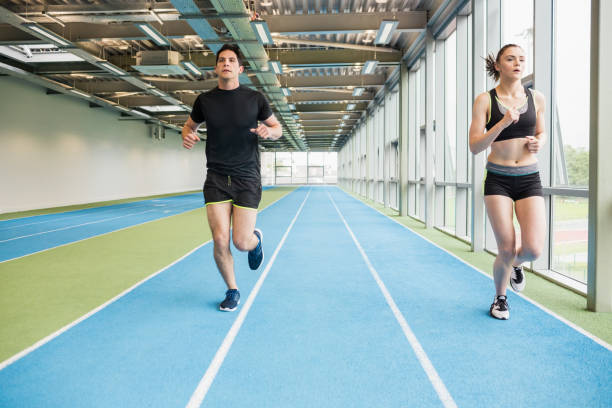 istock Couple running on the indoor track 661075466