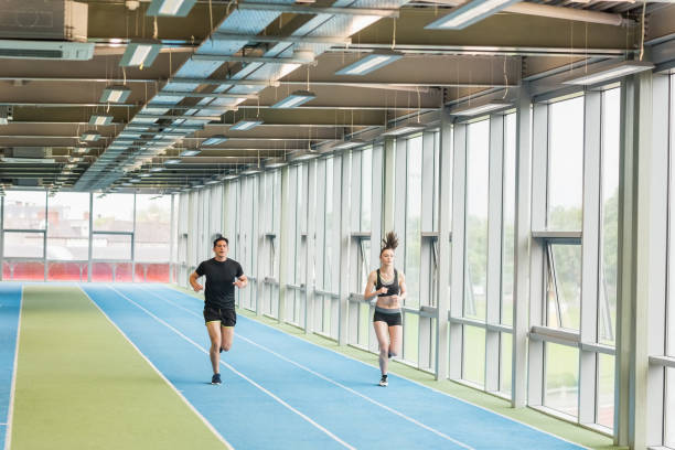 istock Couple running on the indoor track 661075780