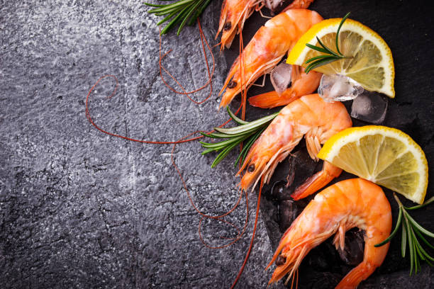 istock Prawns shrimps with lemon and rosemary. 661084354