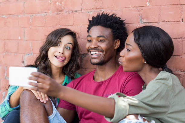 istock Friends taking selfie on a mobile phone 661113934