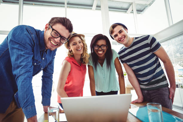 istock Creative business team working hard together on laptop 661116610