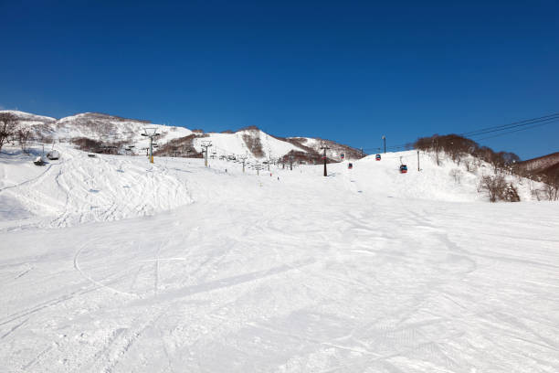 istock Skiers enjoying skiing on a clear bright sunny day 661200992
