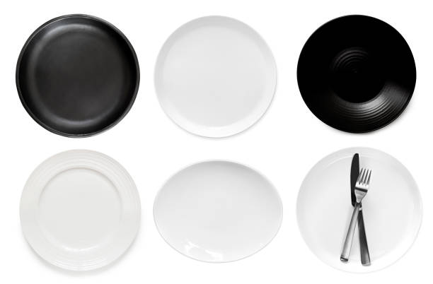Collection of empty plates, top view, isolated on white.