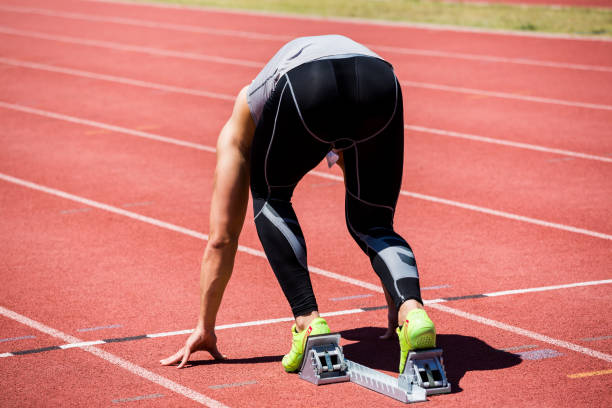 istock Athlete on a starting block about to run 661247160
