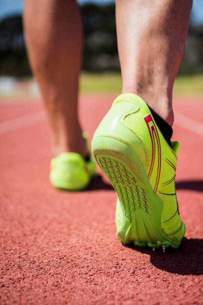 istock Athletes feet running on the racing track 661268442