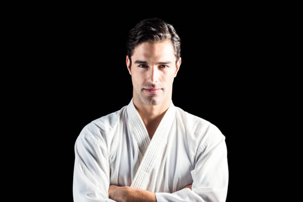 istock Portrait of fighter standing on black background 661289408