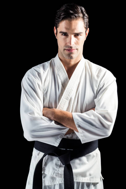 istock Portrait of fighter standing on black background 661291928