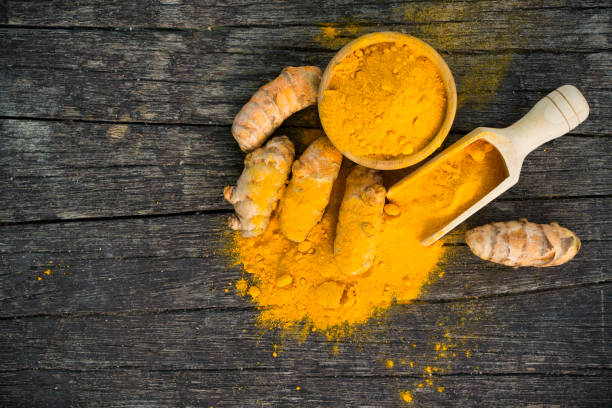 istock Turmeric roots and turmeric powder 661307818