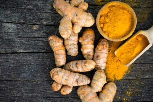 istock Turmeric roots and turmeric powder 661309836