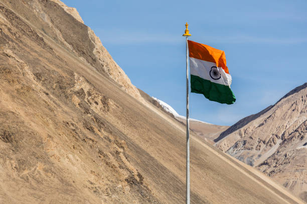 istock India symbol indian flag against mountains and blue sky 661330678