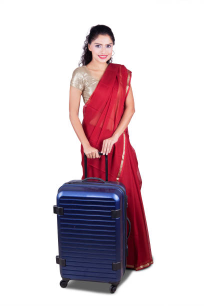 istock Indian woman with suitcase in studio 661379880