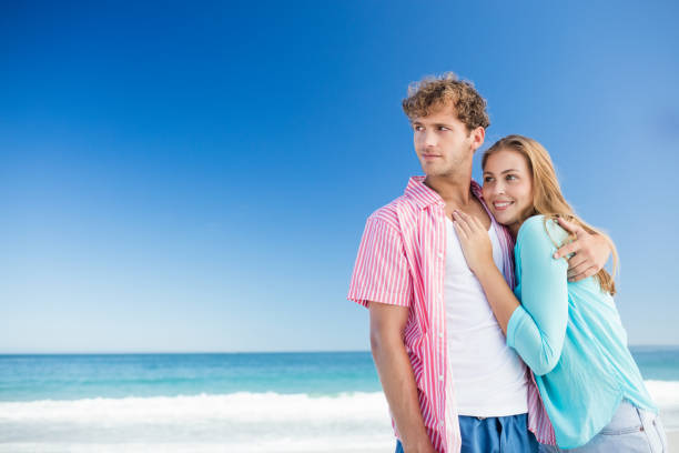 istock Happy couple hugging on the beach 661401610