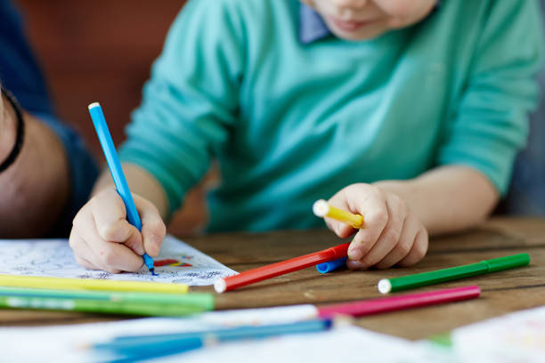 istock Little boy coloring with inspiration 661410244