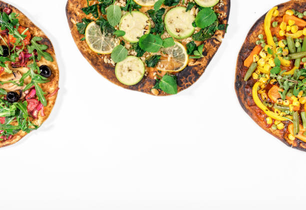 istock Different vegetarian pizza on white background with copy space, top view 661415308