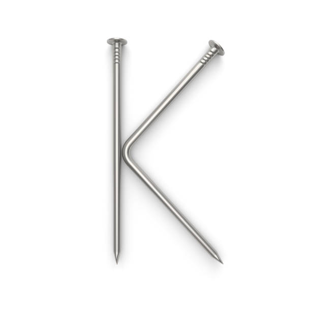 istock Alphabet made from nails, letter K. 661429138
