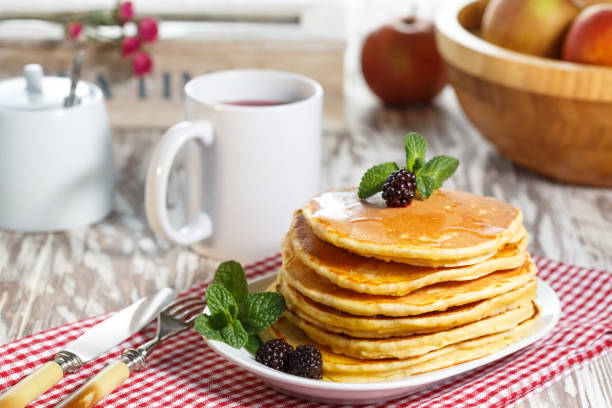 istock Homemade pancakes with honey and berry fruit. Closeup, selective focus. 661429882