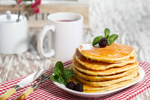 istock Homemade pancakes with honey and berry fruit. Closeup, selective focus. 661429886
