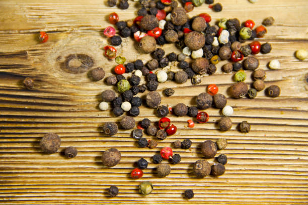 istock Mixture of peppers spice on wooden table 661432770