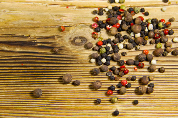 istock Mixture of peppers spice on wooden table 661432772
