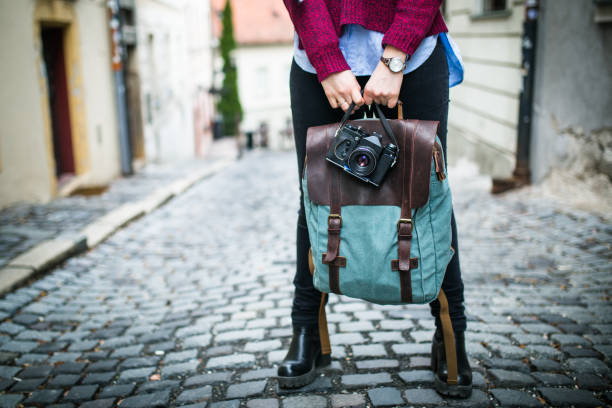 istock Woman traveler with vintage camera 661438992