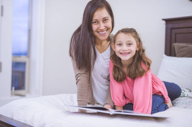 istock Mother and Daughter spending quality time together reading 661439746