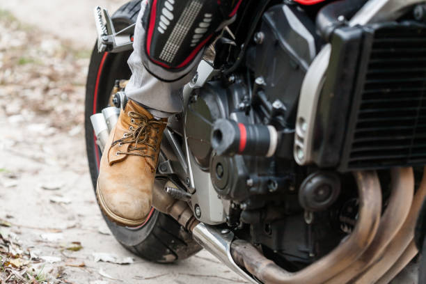 istock Biker sitting on motorcycle, close-up view on legs. 661440484